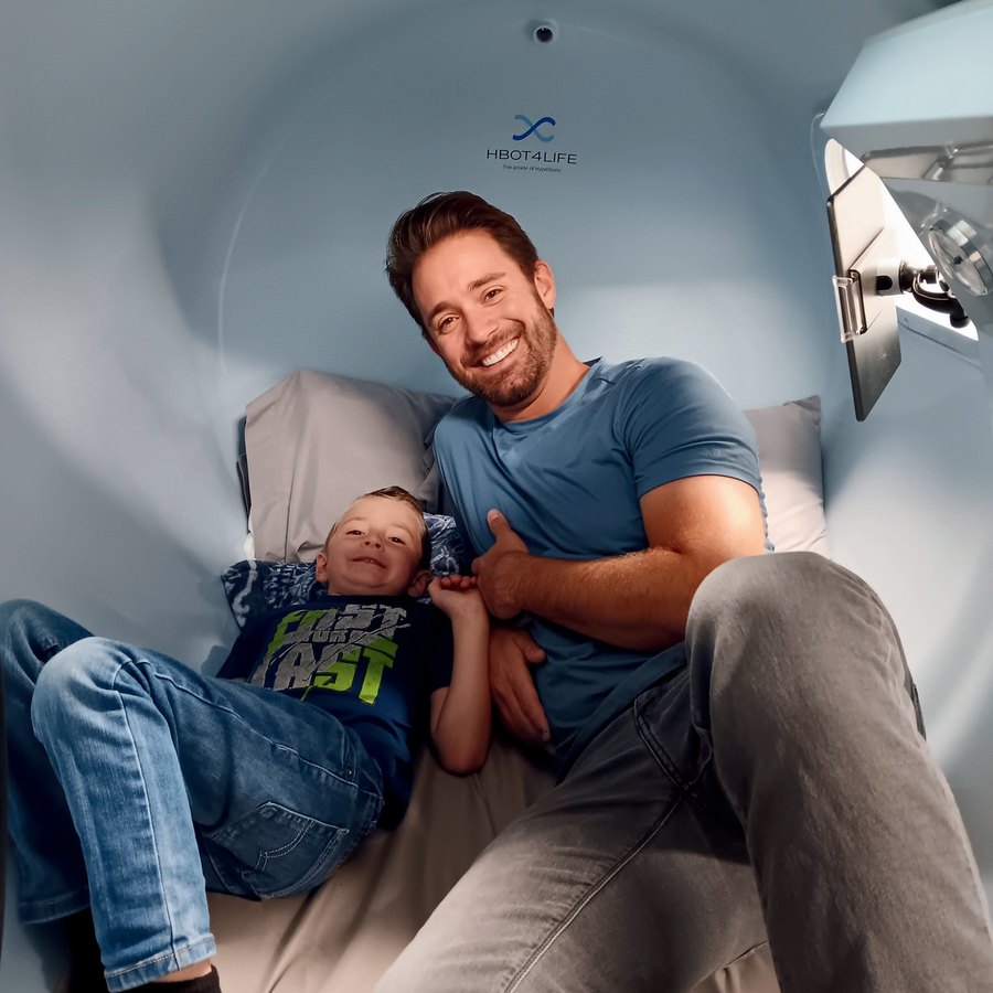 Father and child inside the hyperbaric chamber