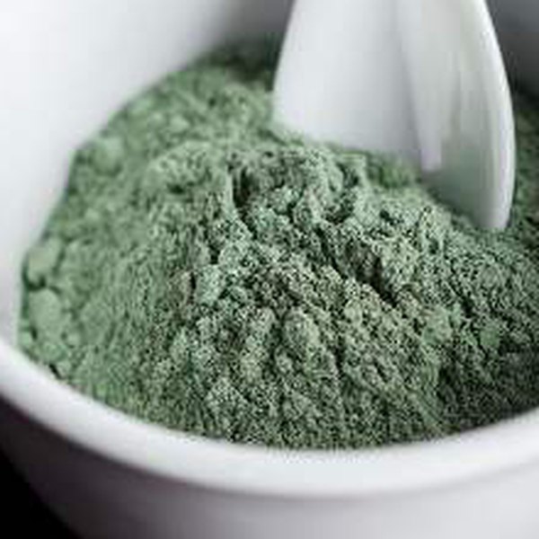 Green clay powder in a bowl
