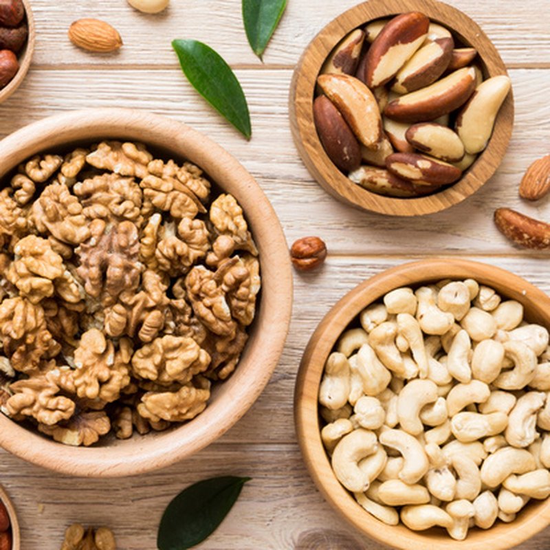 Bowls of walnuts, cashews and mixed nuts