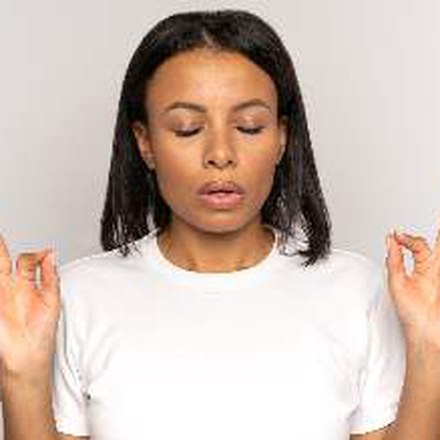 Woman breathing with eyes closed