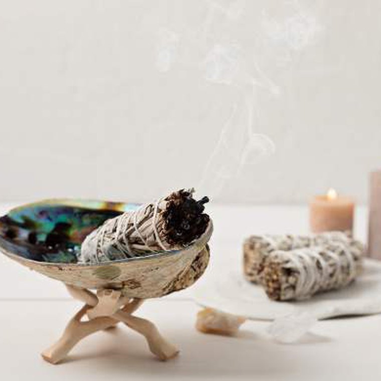 Bowl of dried herbs and sage bundles