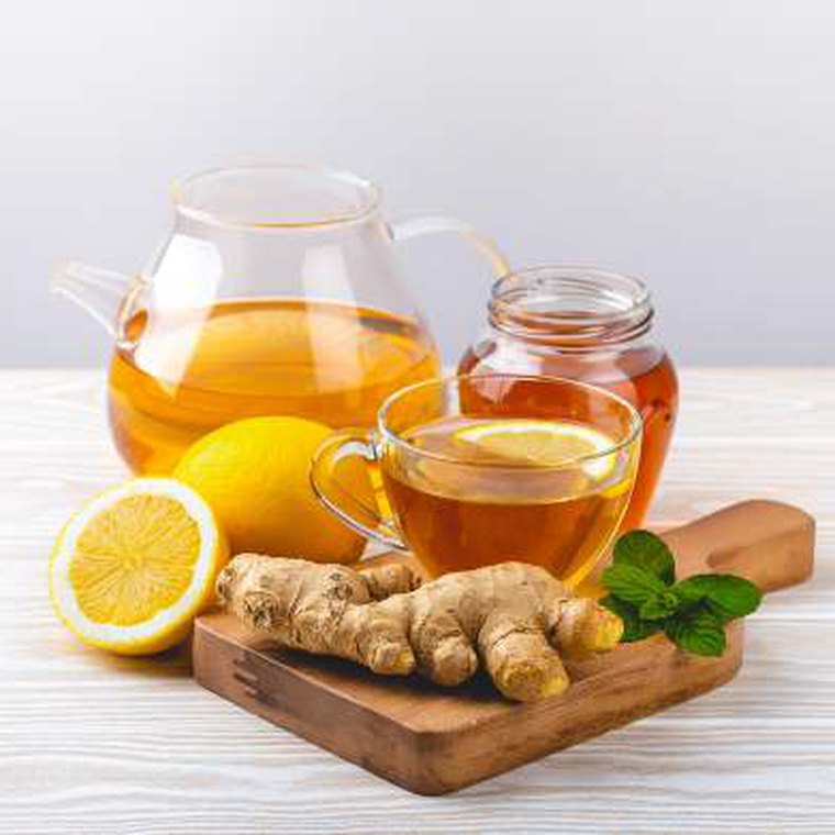 Teapot with lemon and fresh ginger